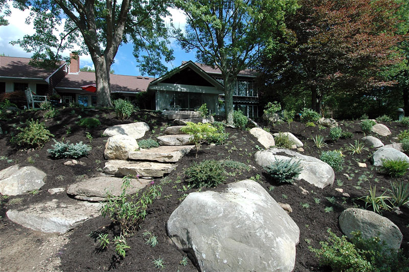 garden soil with rocks and hardscape